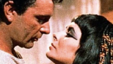 Antony and Cleopatra are about to kiss. 